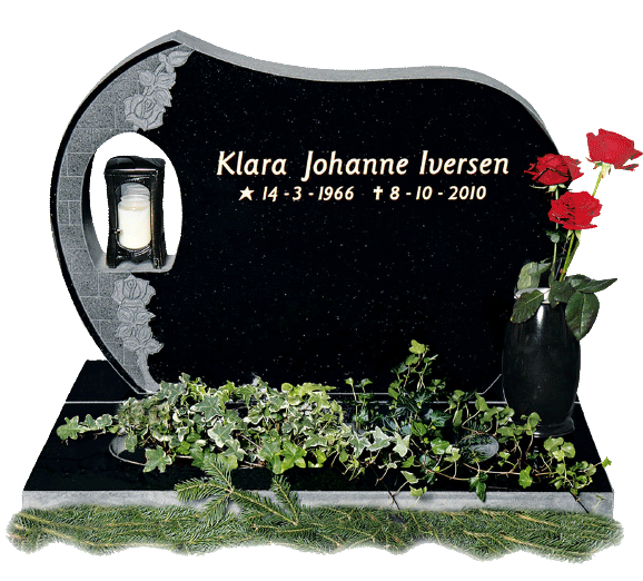 gravminne i sort granitt med blomster og bronselykt i gull skrift